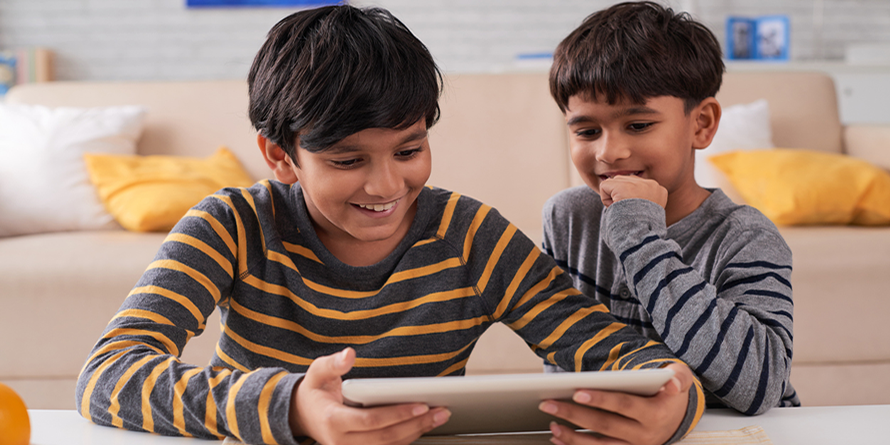 Two Boys Reading on Tablet