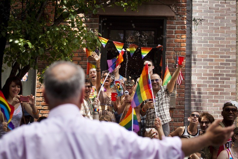 The annual civil rights demonstration commemorates the Stonewall riots of 1969, which erupted after a police raid on a gay bar, the Stonewall Inn on Christopher Street.