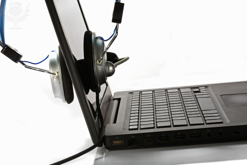 Side view of a laptop and a headphone